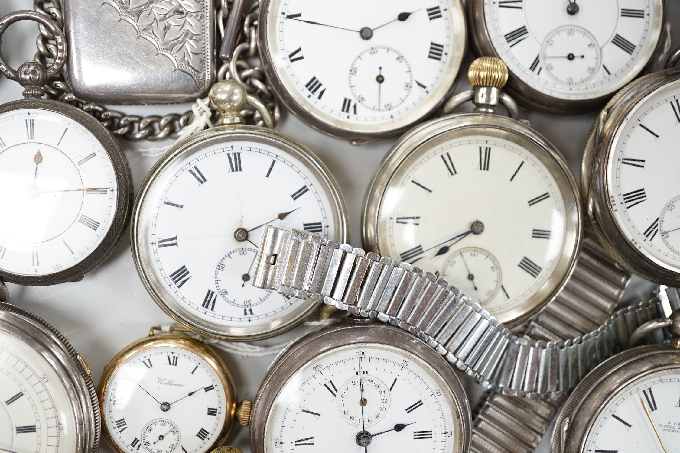 Twenty one assorted silver or base metal pocket watches including Waltham and Child of Birmingham, three wrist watches and a silver vesta case.